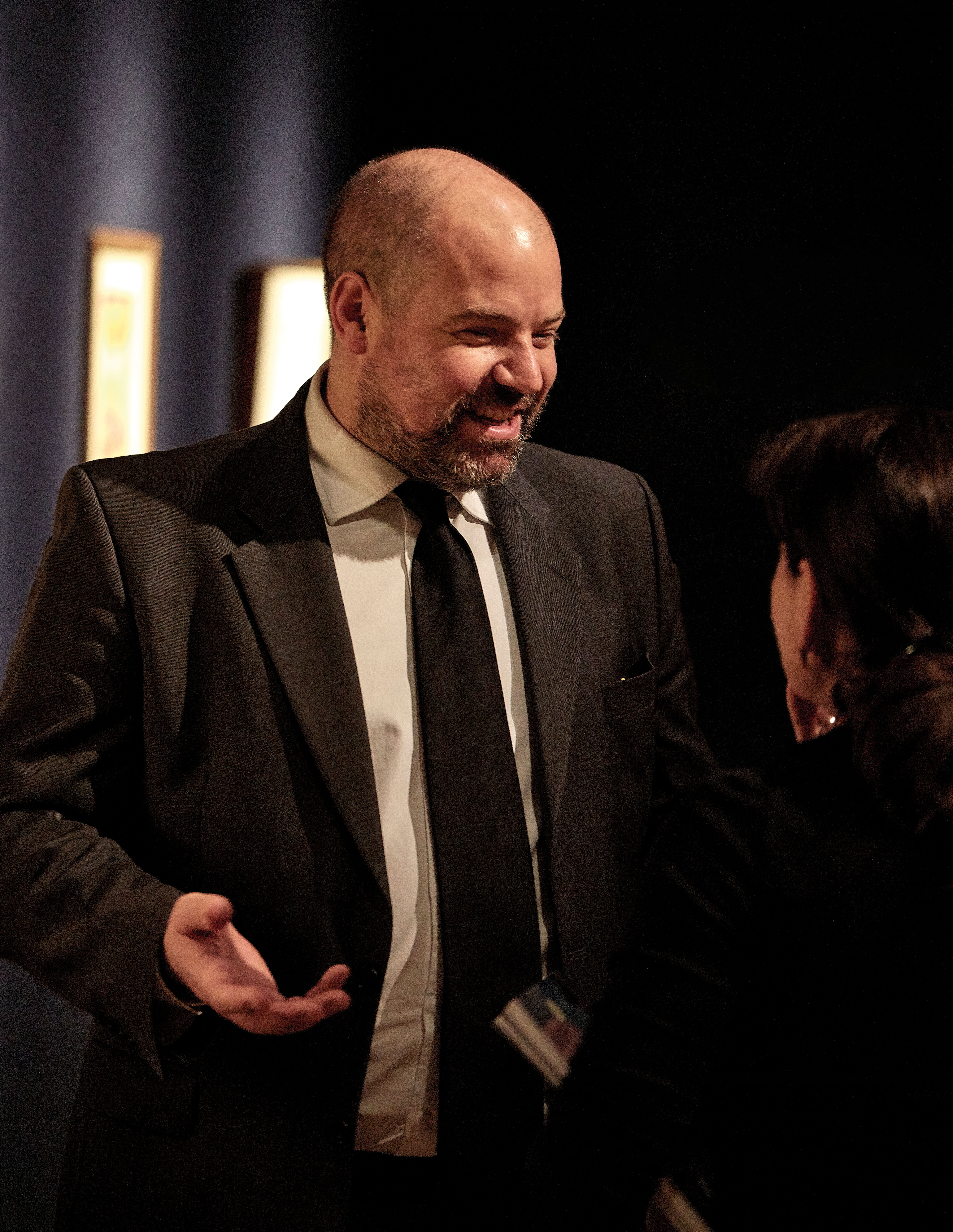 Jay Vincze in conversation at an art event