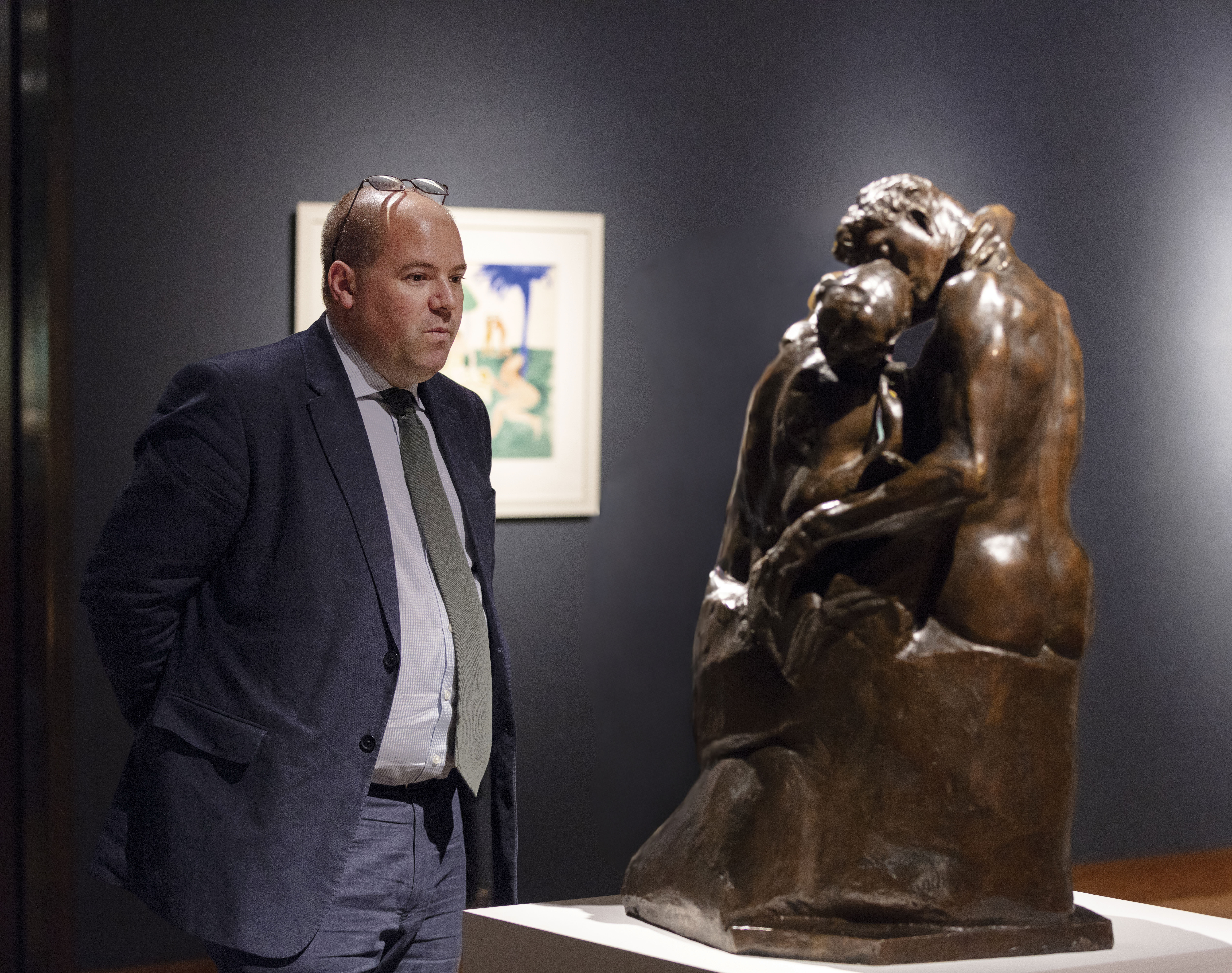 Jay Vincze viewing artwork